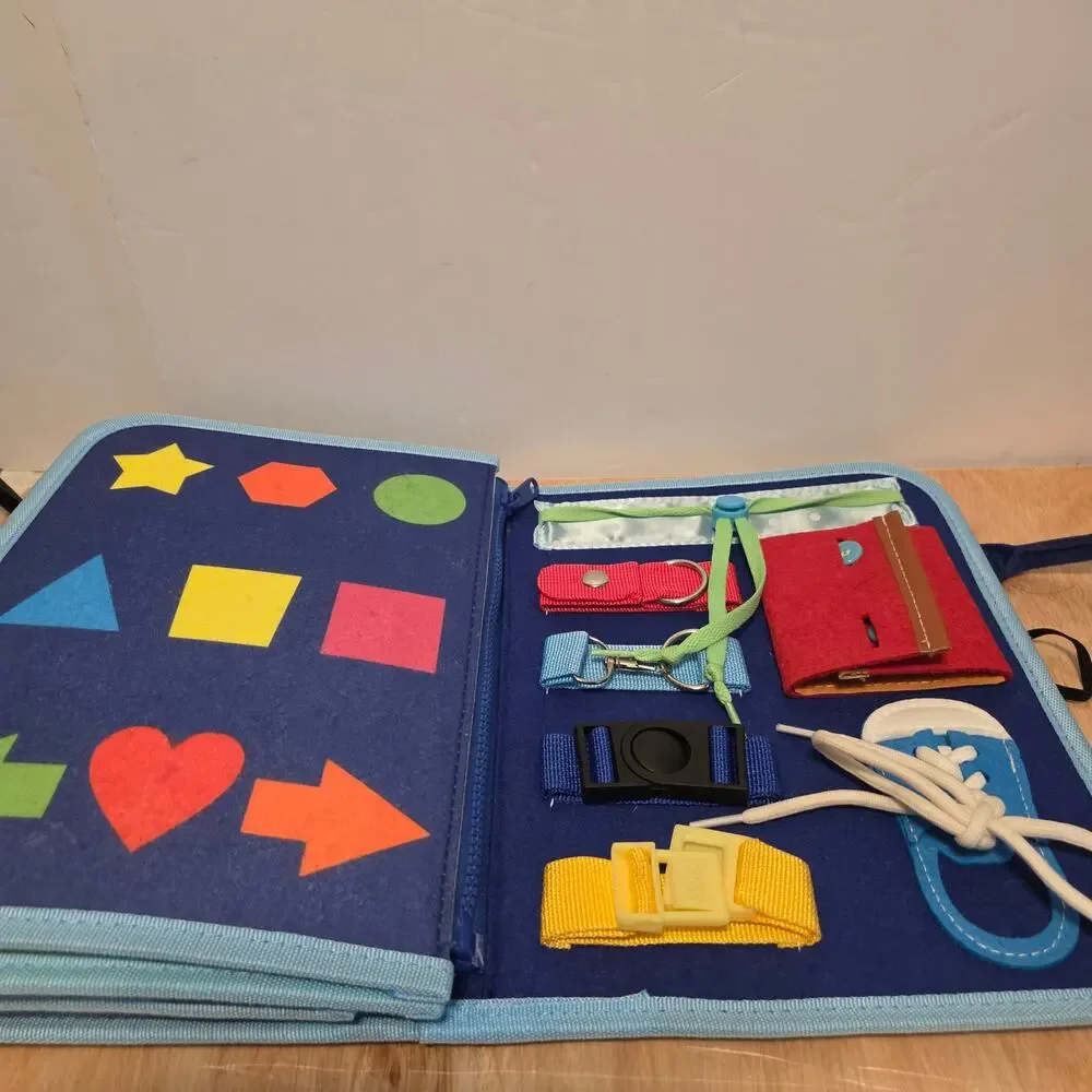 Esjay Toddler Busy Board in a portable dinosaur-themed felt carry case